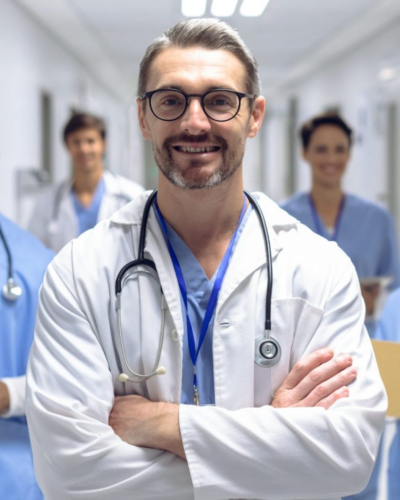 diverse-medical-team-of-doctors-looking-at-camera-while-holding-clipboard-and-medical-files-e1623252244361-pf2n5igpmfm4ppl9w5nt89pd7hae8a7fb8ryn904qo (1)